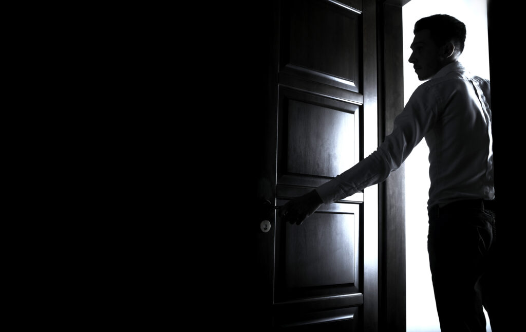 Man Entering Dark Room